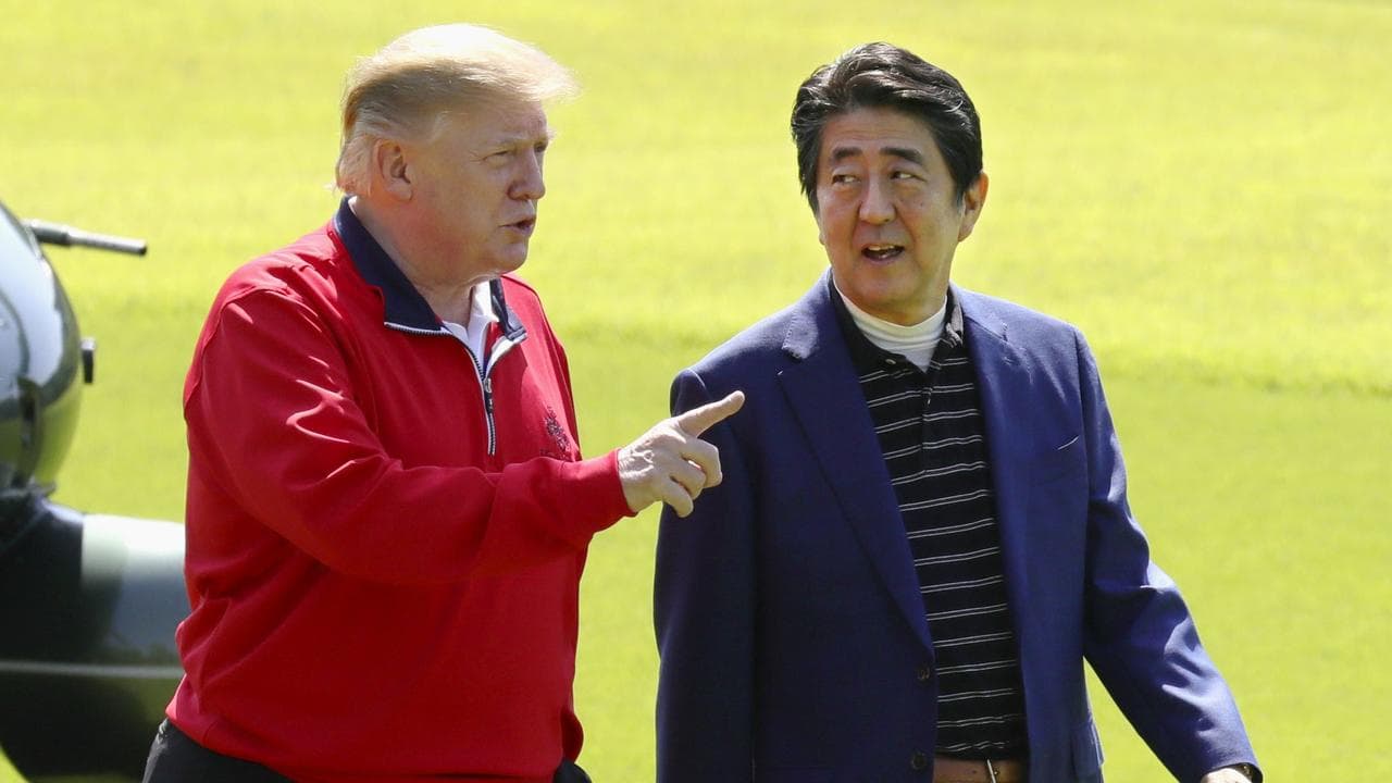 Donald Trump and Shinzo Abe play golf near Tokyo in 2017