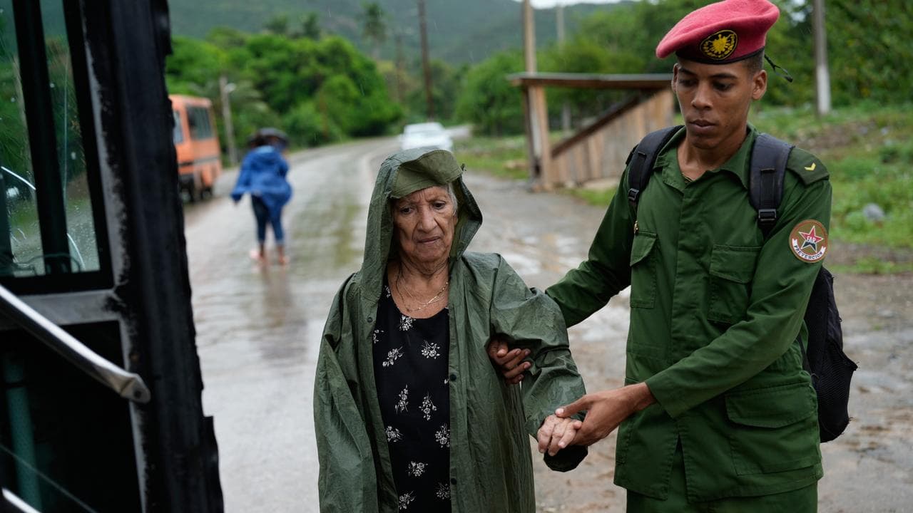 A Cuban woman being evacuated ahead of Hurricane Melissa 