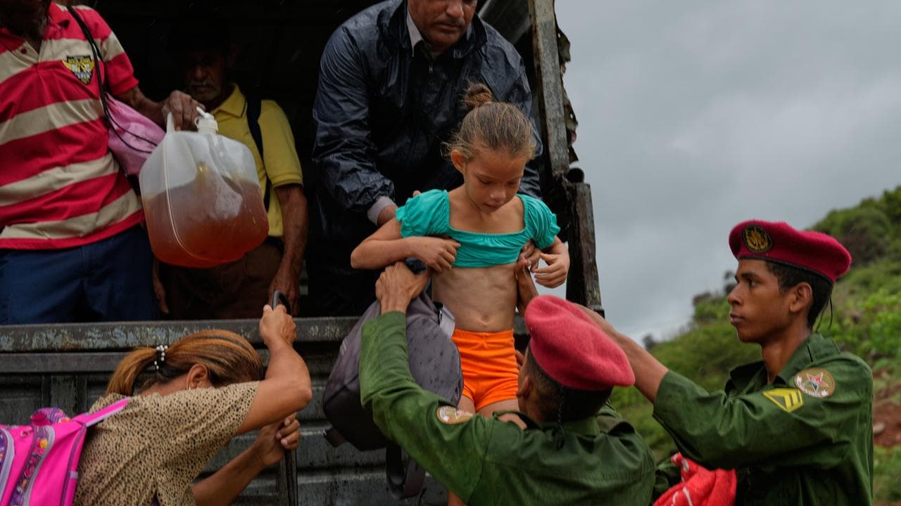 People leave before the arrival of Hurricane Melissa in Canizo, Cuba