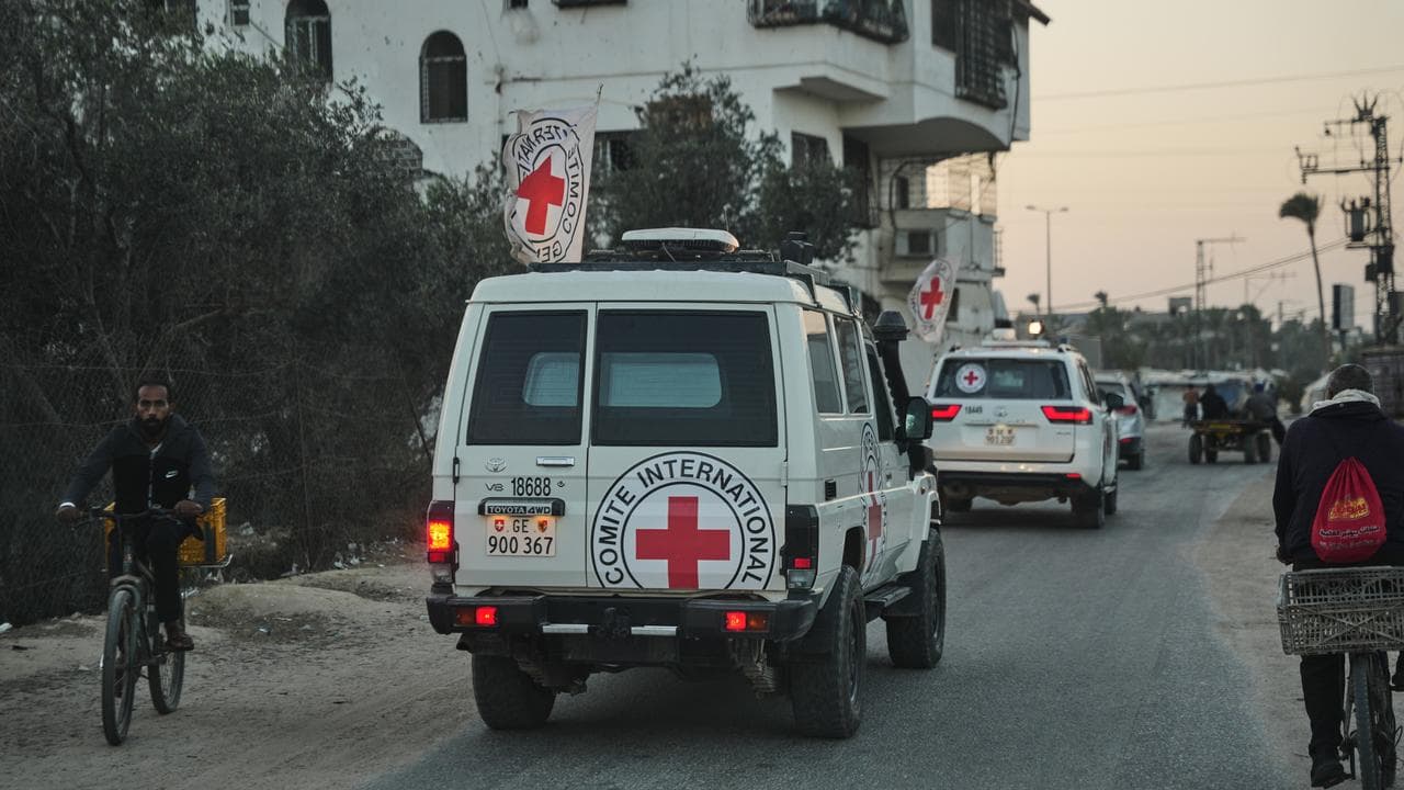 Red Cross vehicles carrying the bodies of two hostages in Gaza