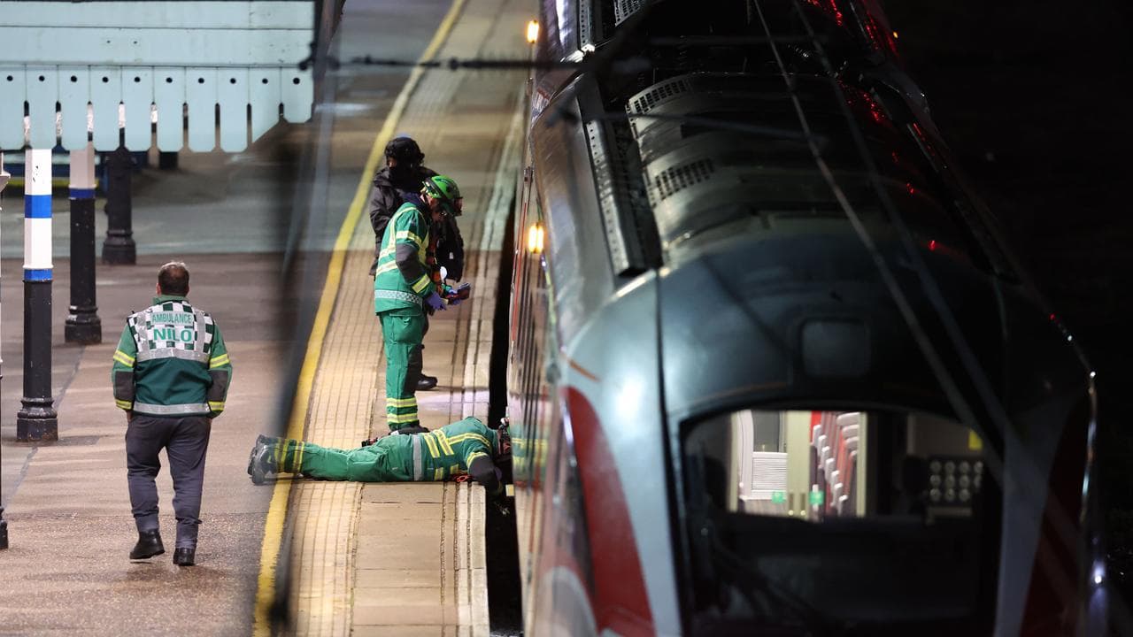 Emergency personnel inspect a train at the Huntingdon, train station 