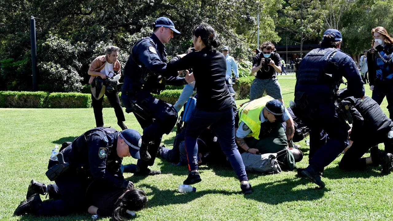 Police scuffled with protesters trying to blockade a weapons expo.