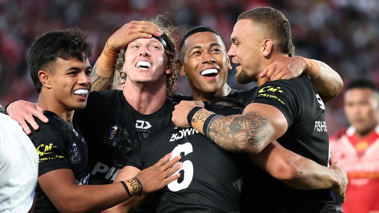 New Zealand players celebrate Phoenix Crossland's try