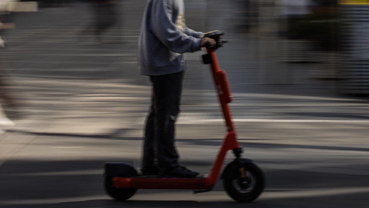 A person riding an electric scooter (file image)