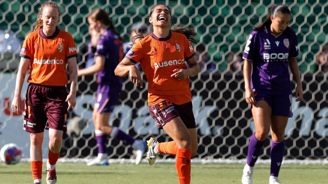 Grace Kuilamu of the Roar celebrates after scoring a goal.