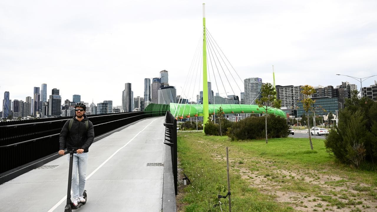 A e-scooter rider on the Dynon Road bridge in Melbourne