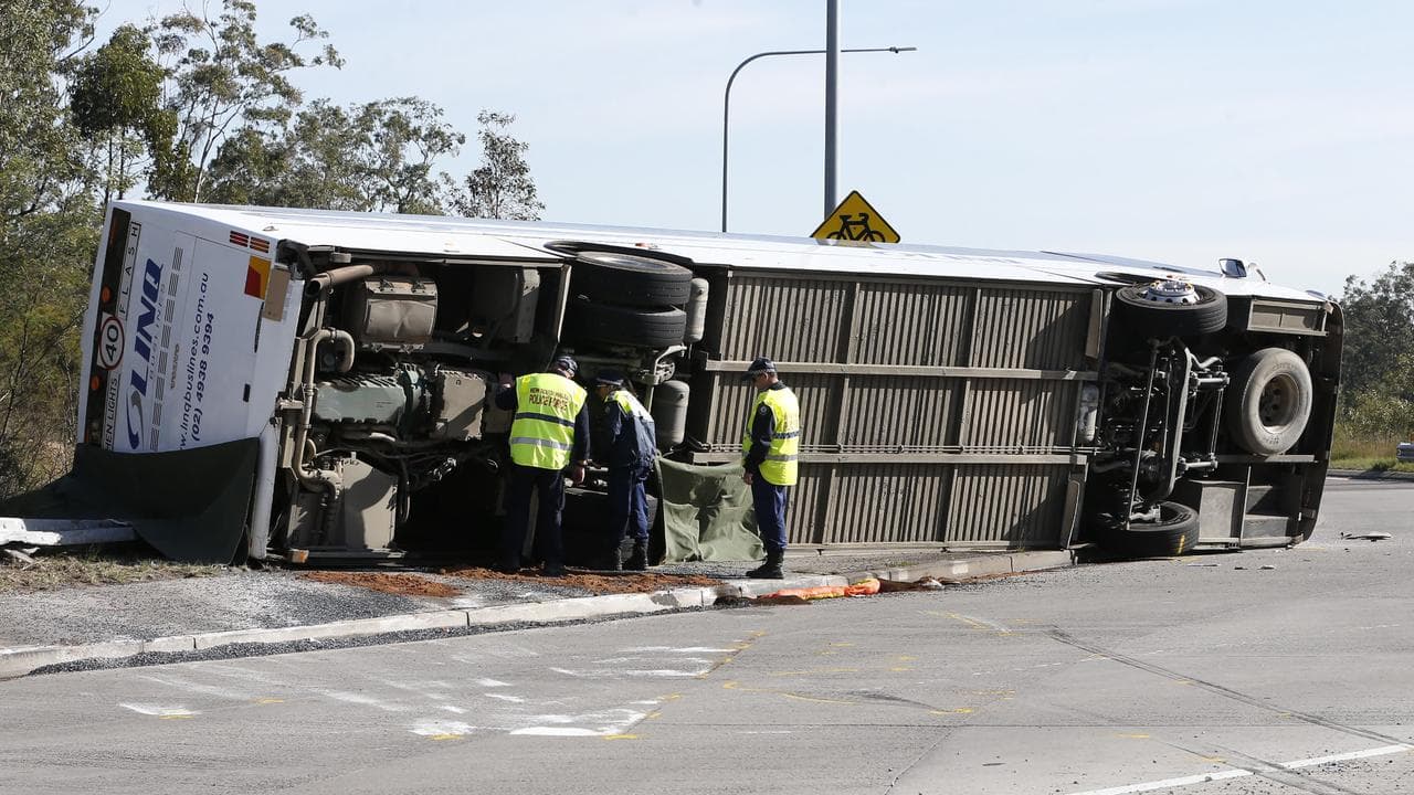 Investigators at the scene of a bus crash