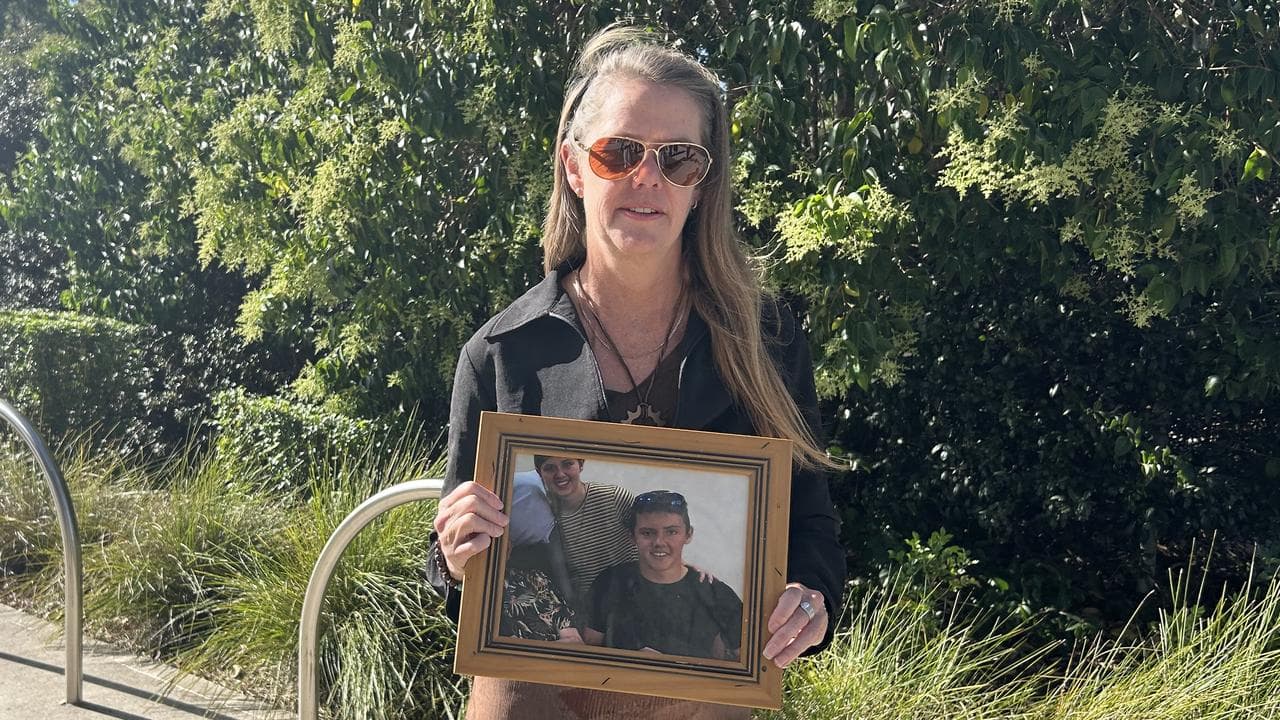 Myfanwy Webb holds a photo of her son Jeremy Webb