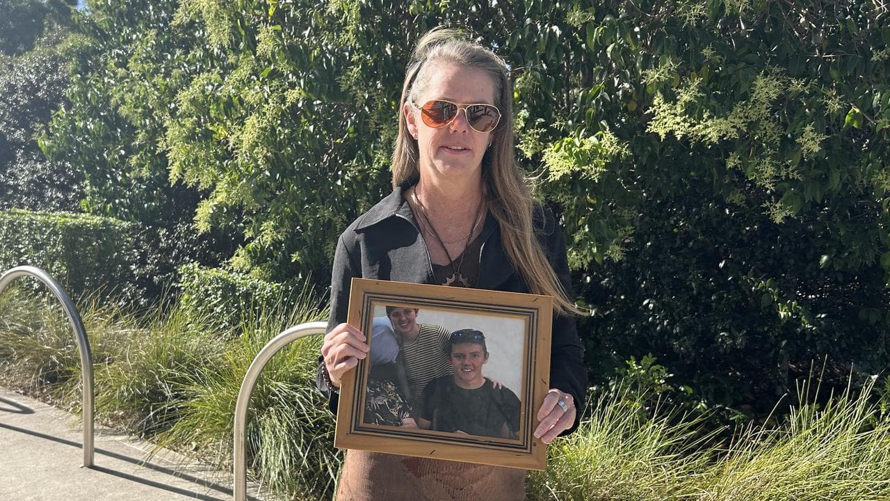 Myfanwy Webb holds a photo of her son Jeremy Webb
