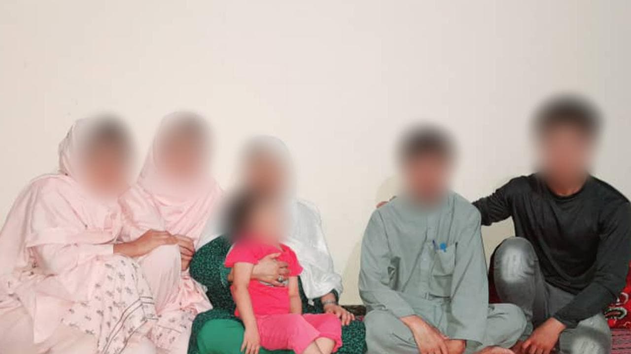 Afghan woman Najma and her family