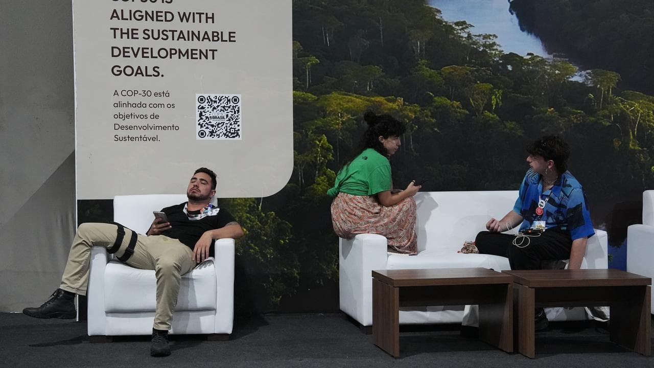 A COP30 attendee rests