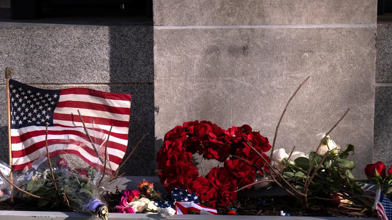 Flowers where two National Guard members were shot in Washington.