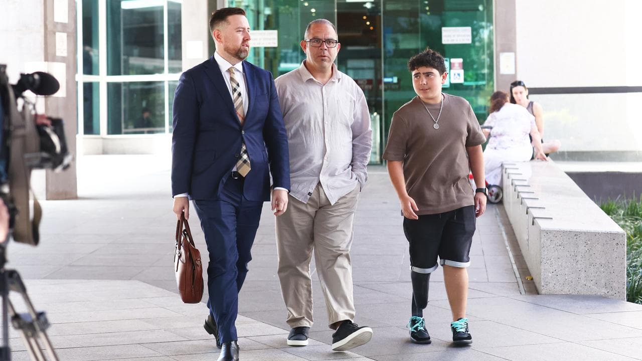 Simon Tadros (C) and his son Nicholas (Right) 