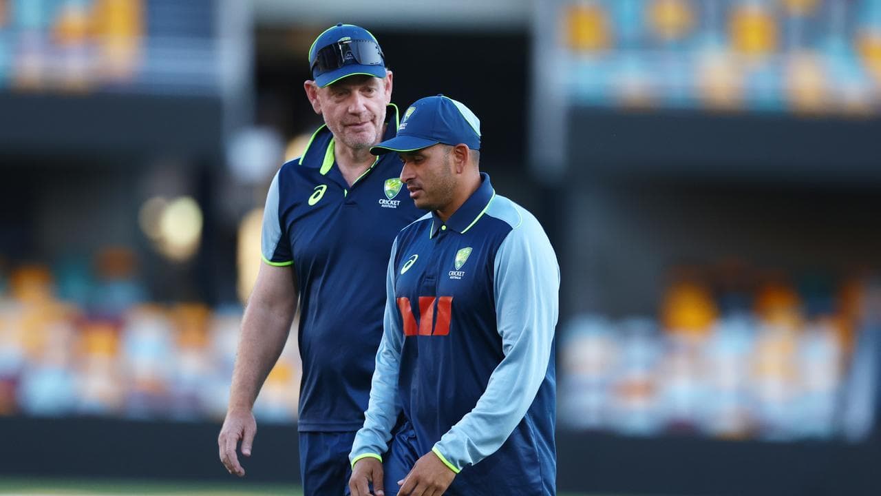 Khawaja (R) with coach Andrew McDonald.