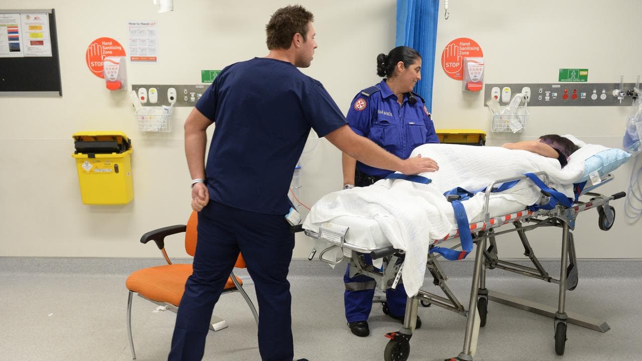 Ambulance and medical staff attend to a patient (file image)