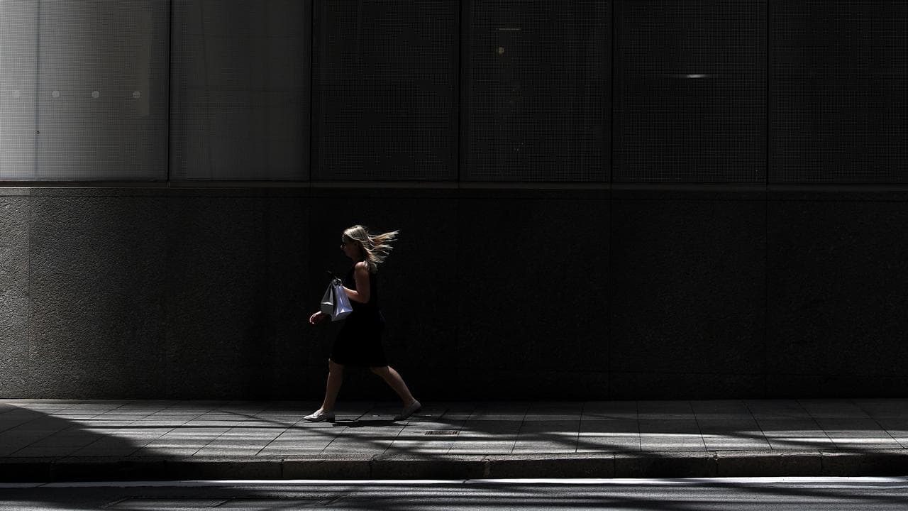 Office workers are seen in Sydney