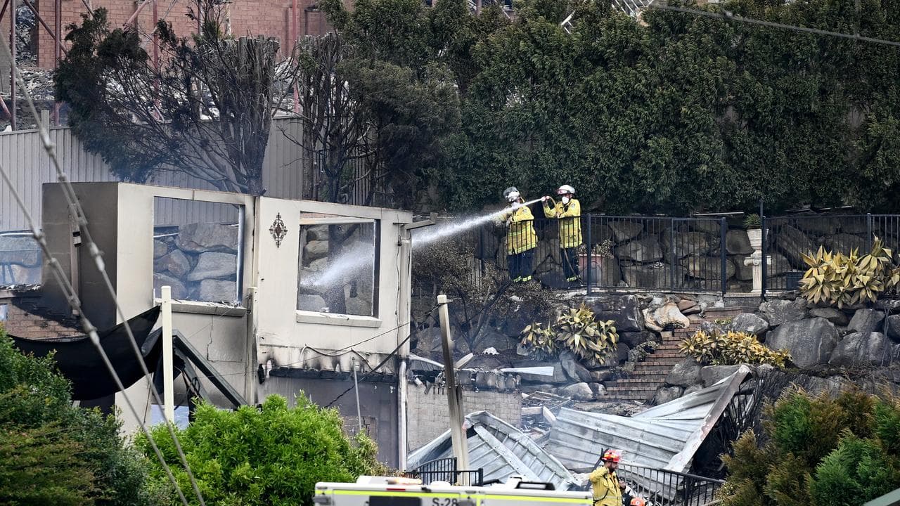 Firefighters hose down a property at Koolewong