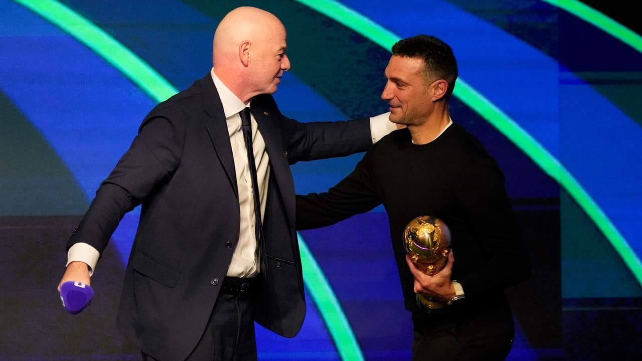 Gianni Infantino greets Argentina coach Lionel Scaloni