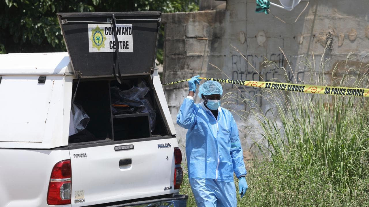 Forensic personnel where bodies of the victims of a mass shooting