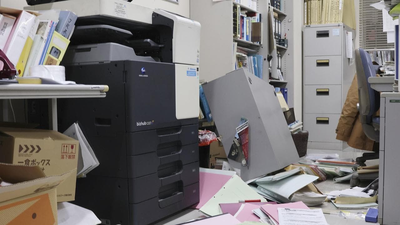 Papers are scattered on the floor at an office in Hakodate, Hokkaido