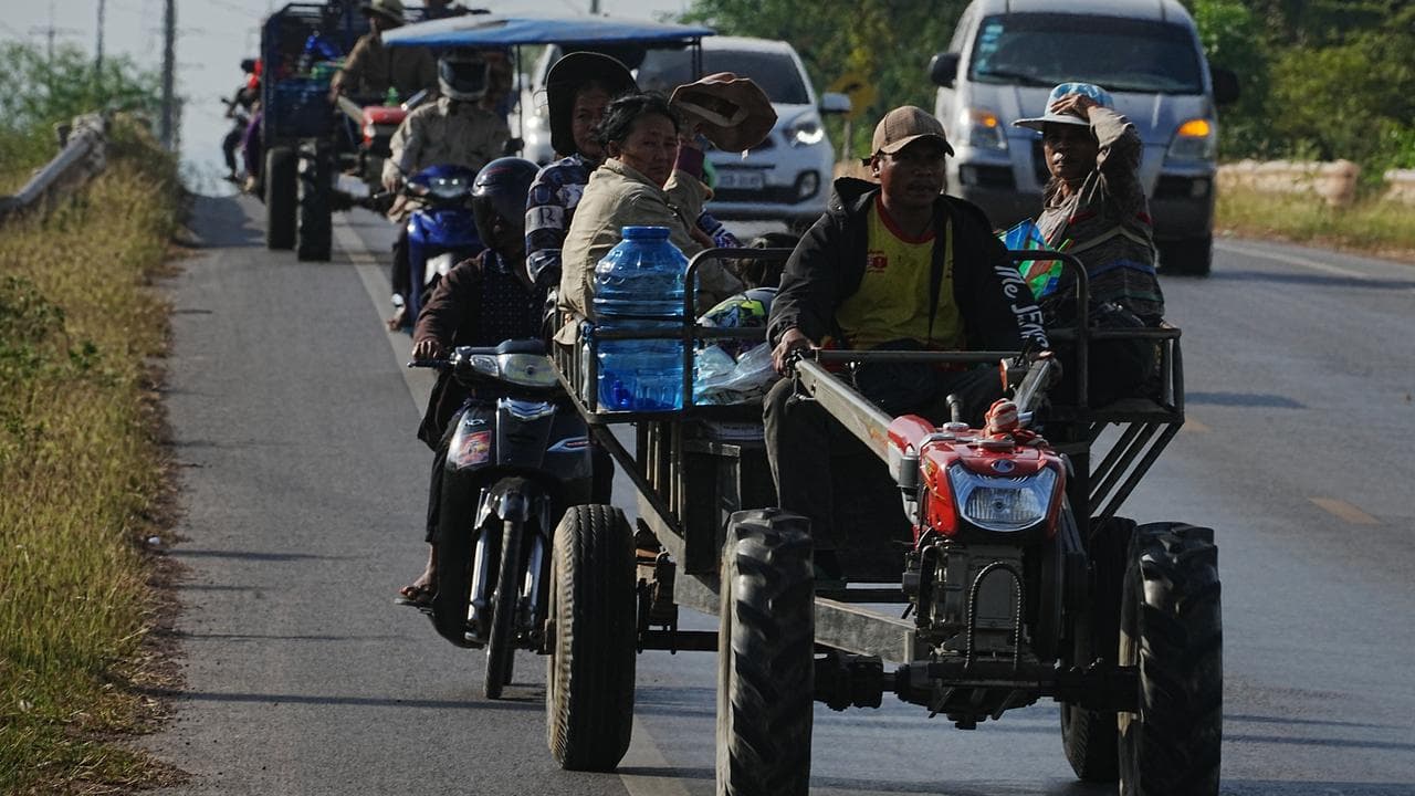 Cambodian residents flee from their home 