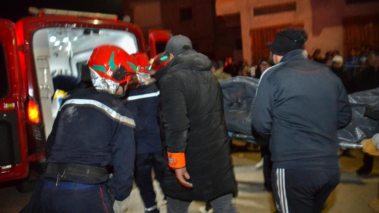 Rescue workers in the wreckage of collapsed buildings in Fez, Morocco