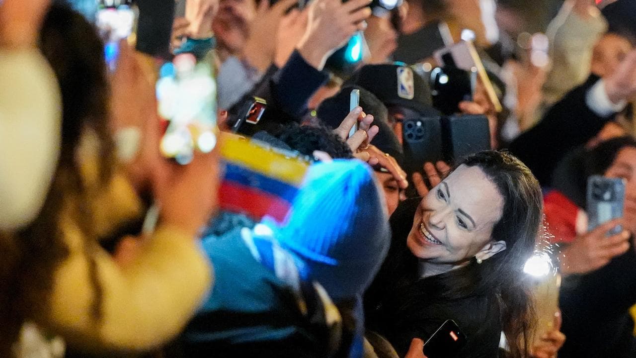 Nobel laureate Maria Corina Machado greets a crowd in Oslo