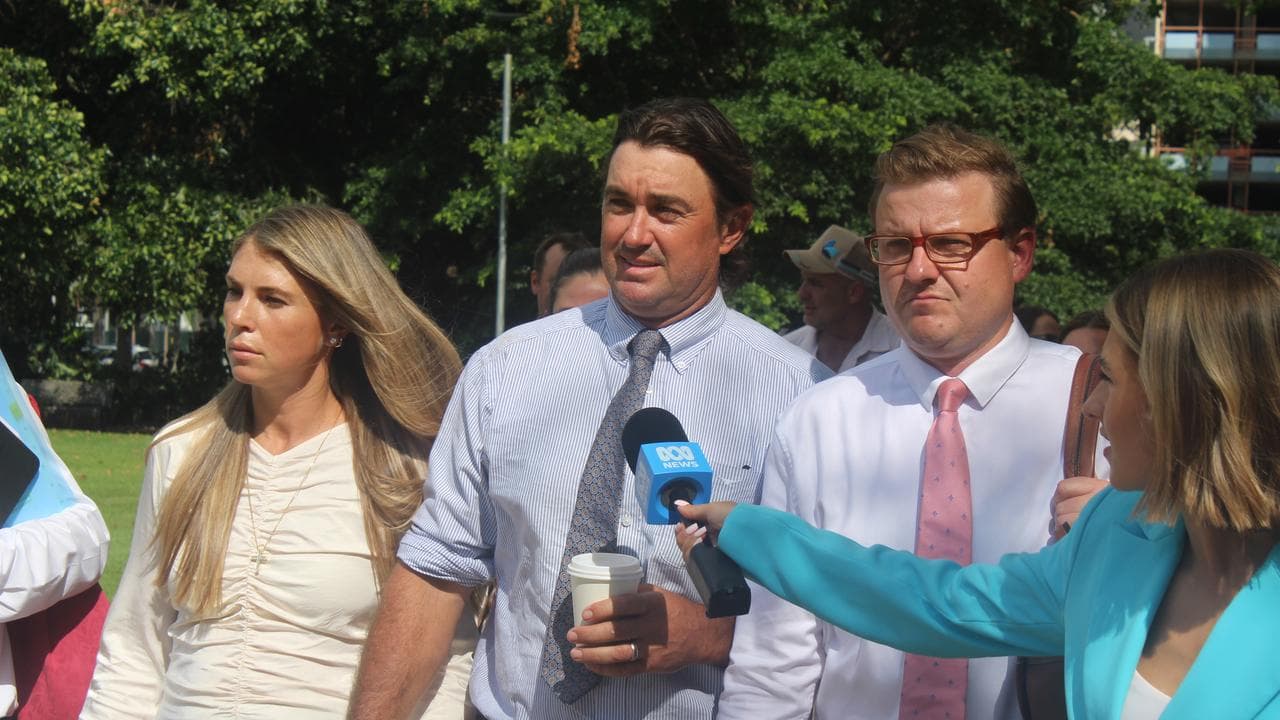 Matt Wright, flanked by wife Kaia and lawyer Luke Officer