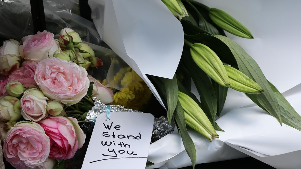Flowers and messages of support  outside the Hobart synagogue.