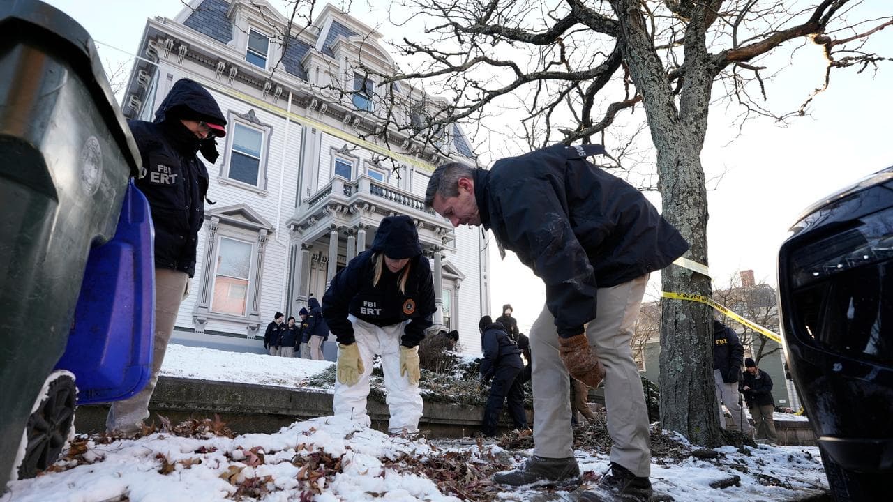 FBI agents search for evidence near the campus of Brown University