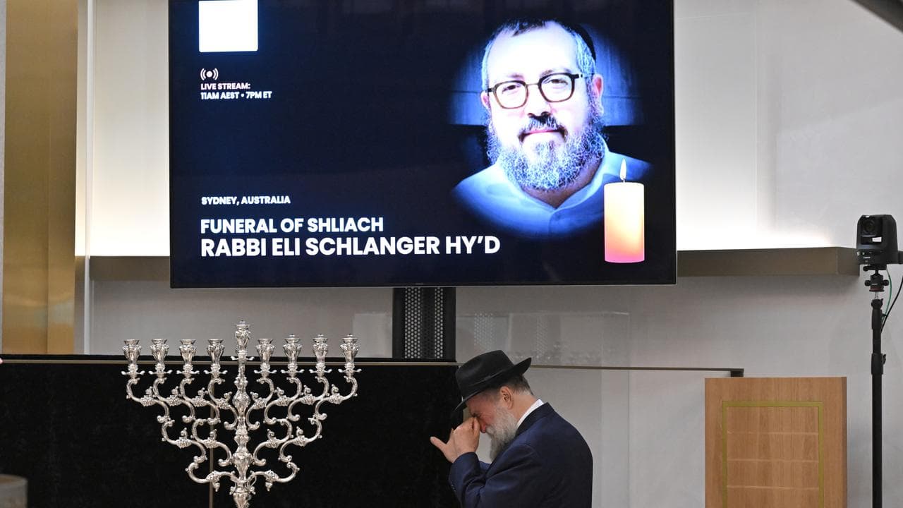 Family grieve over the casket