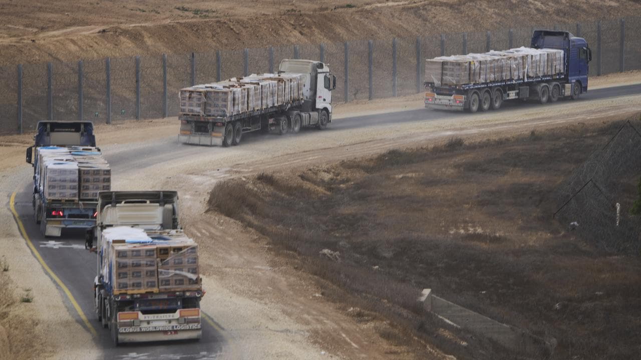 Trucks carrying humanitarian aid for Palestinians in Gaza