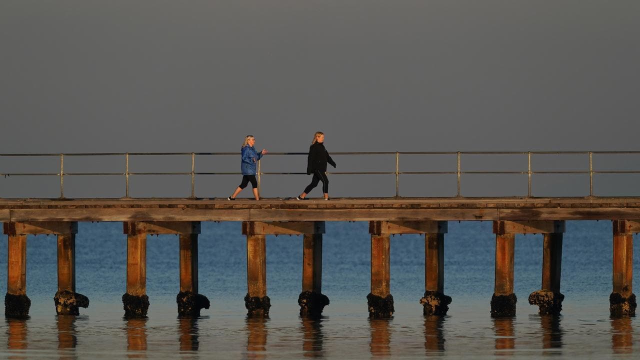 Local residents walk on Mordialloc Pier (file image)