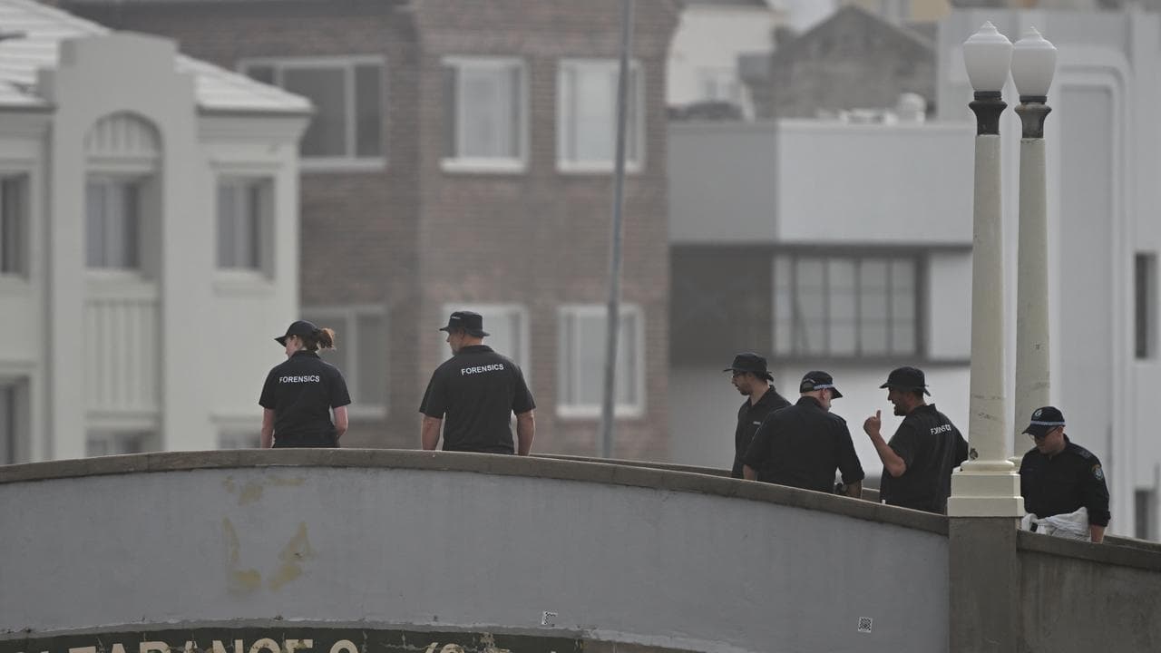 Forensic officers on a bridge at Bondi