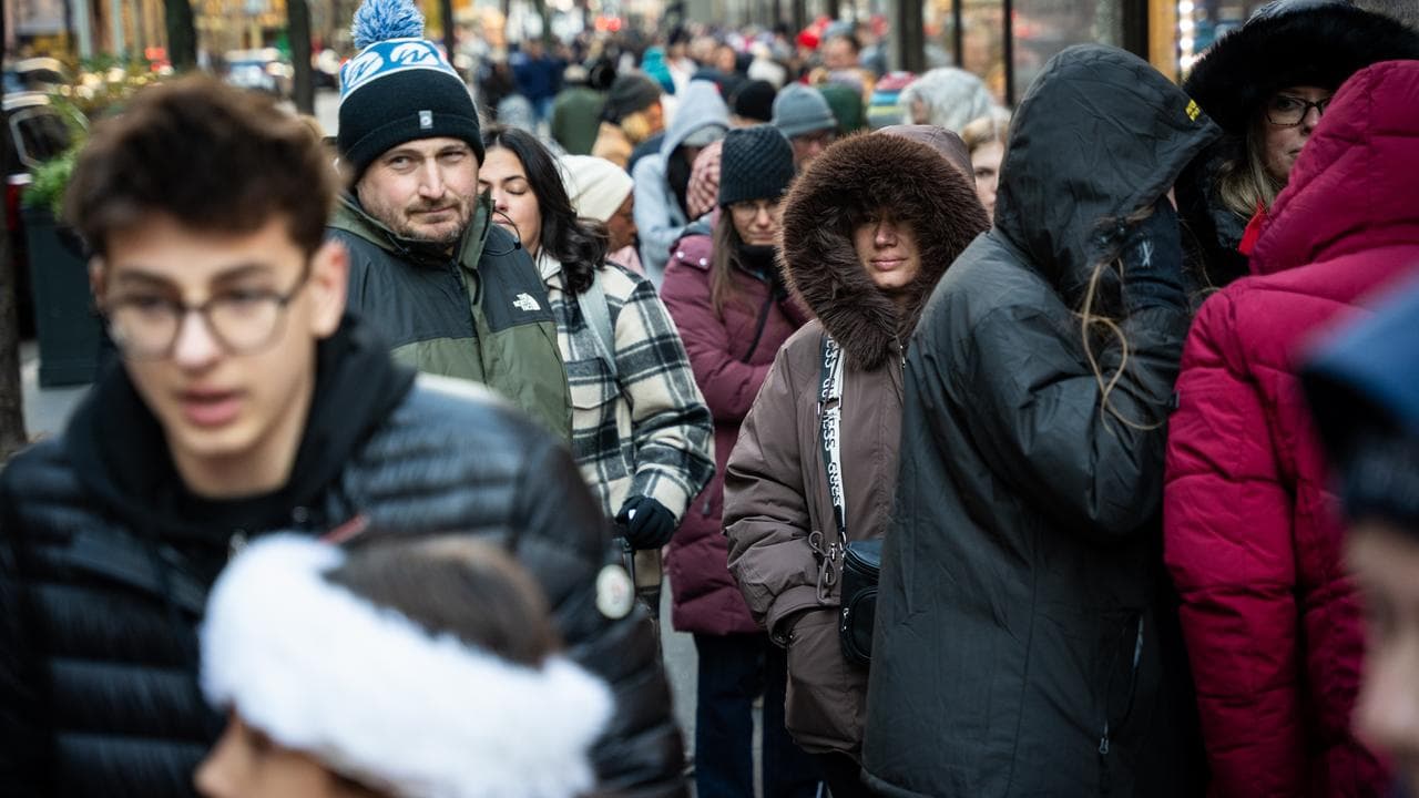 Black Friday shoppers queue to enter FAO Schwarz in New York