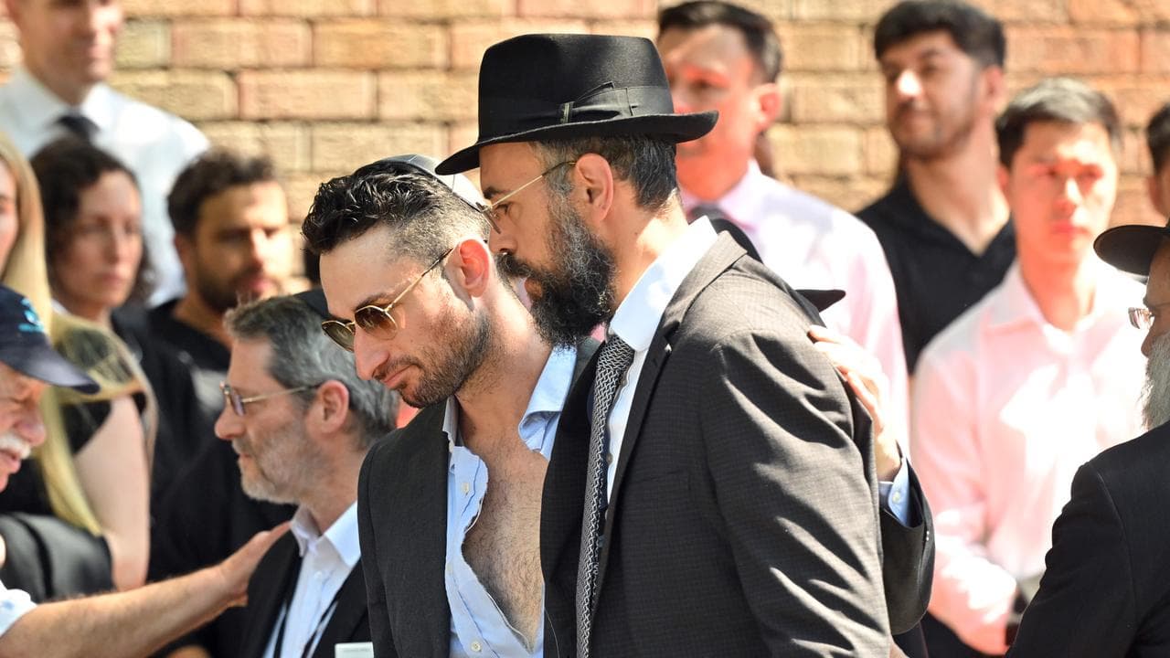 Family are seen during the funeral service for Boris and Sofia Gurman
