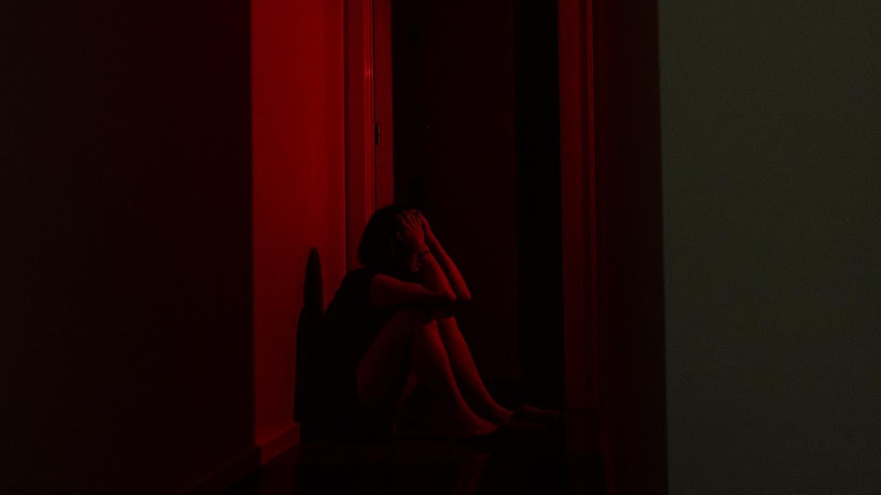 A person poses for a photograph