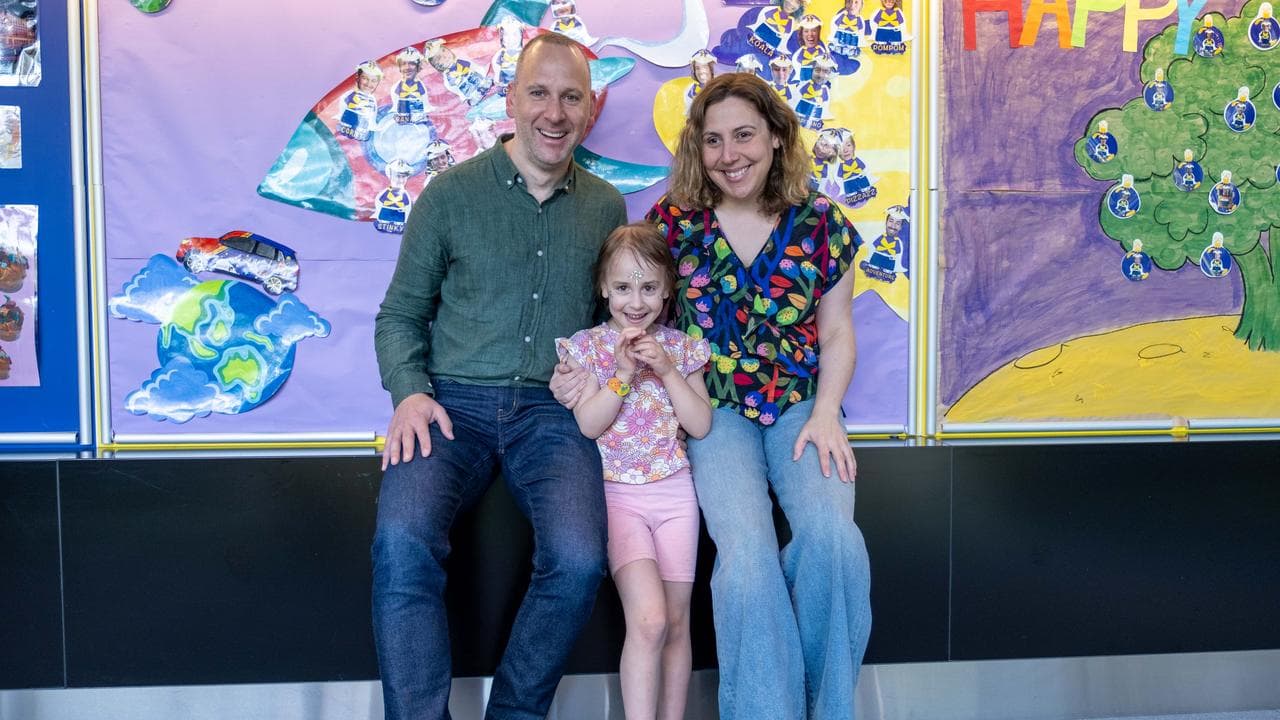 Maeve Surkis with her parents Mitch and Amy