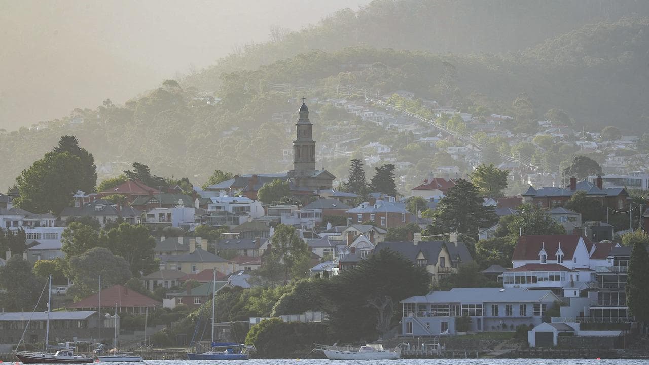 Houses along the Derwent River in Hobart in the late afternoon light