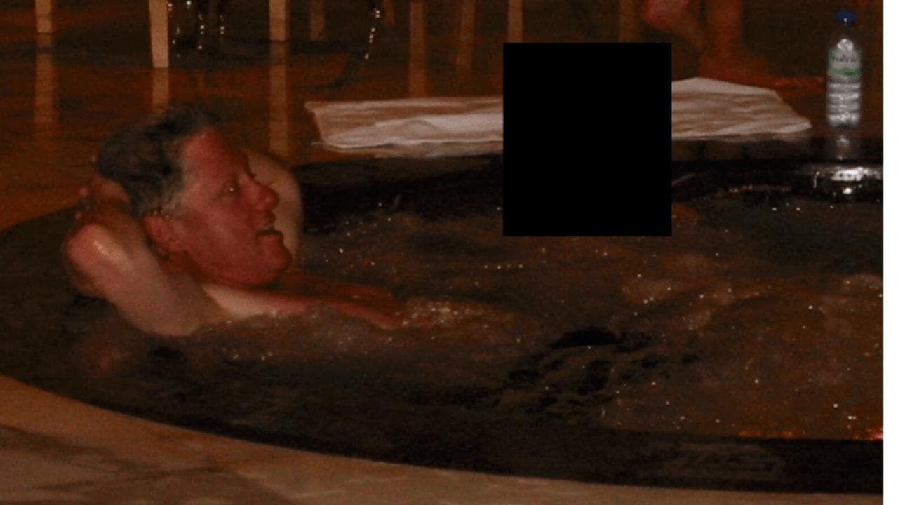 former President Bill Clinton in a hot tub with an unknown person