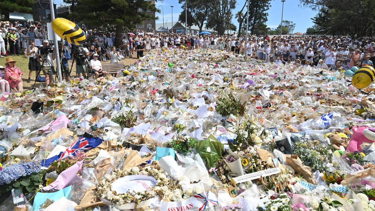 Mourners and flowers at the Bondi Pavilion