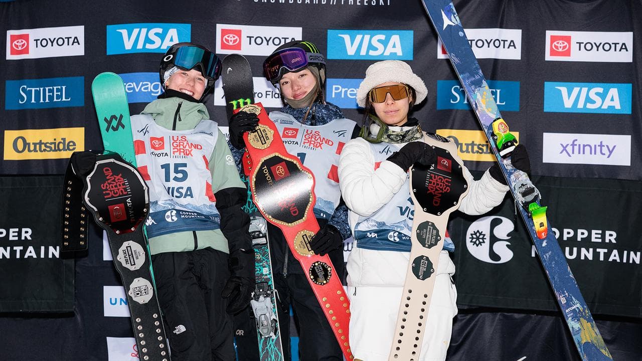 Indra Brown on the podium with Zoe Atkin and Kexin Chang.