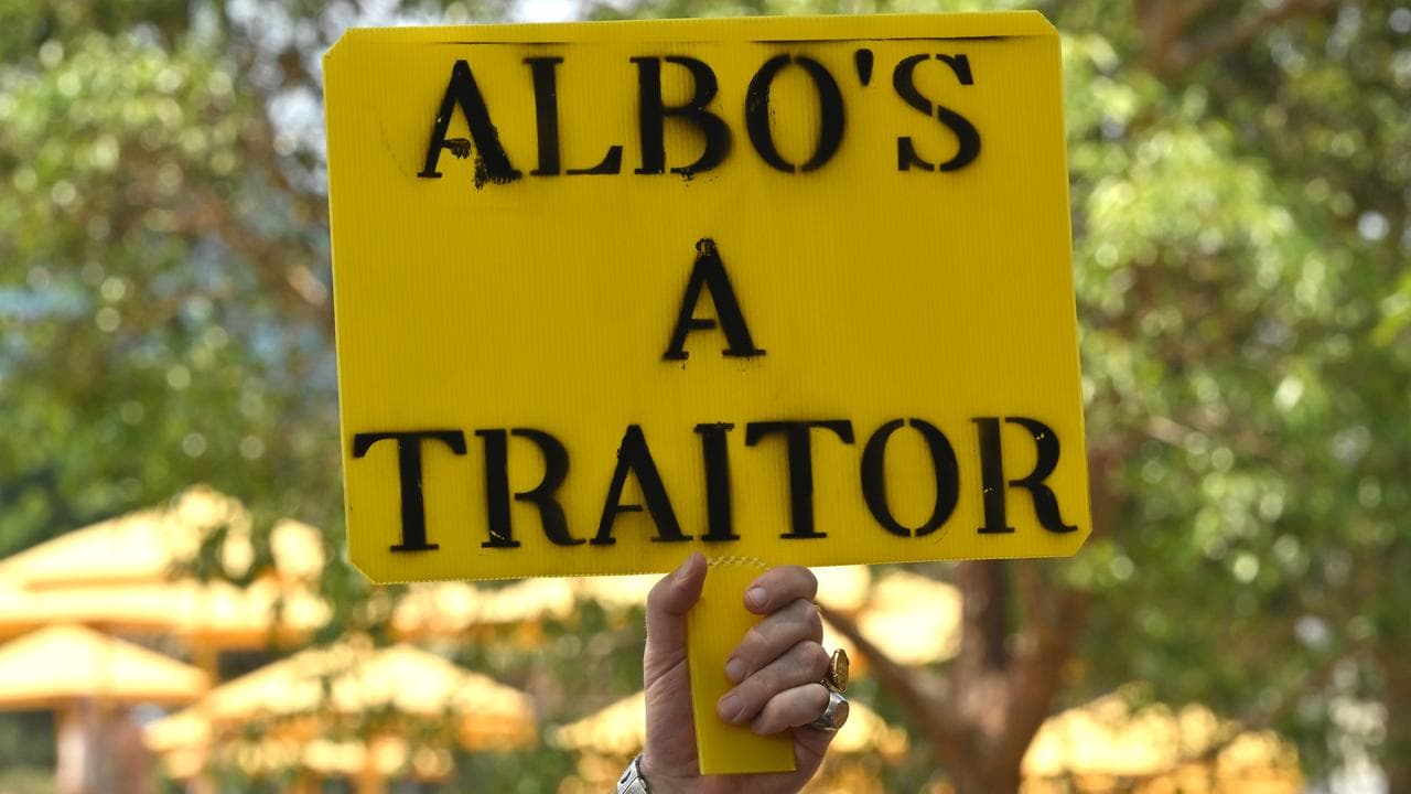 A protester hold a sign during a rally