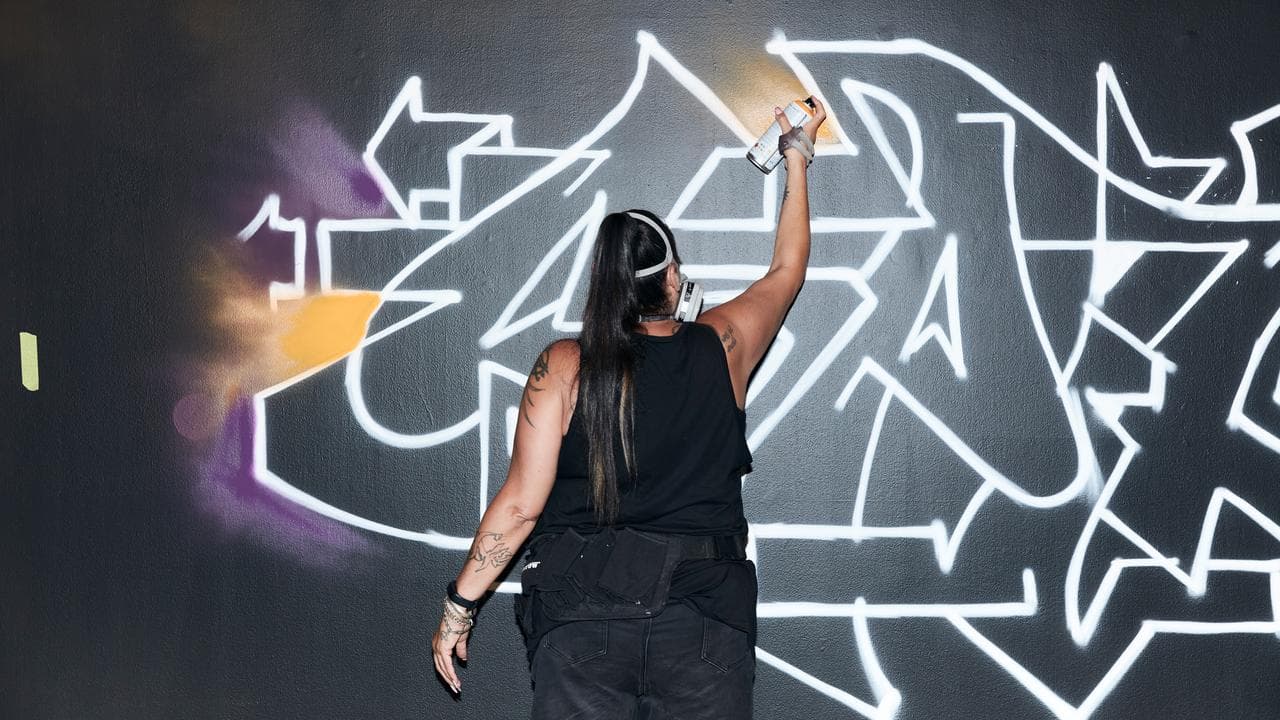 An artist at the National Art School gallery