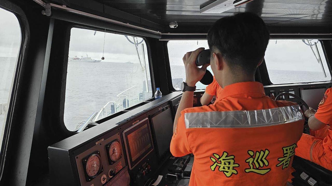 Taiwan Coast Guard member monitor Chinese navy vessel in 2024