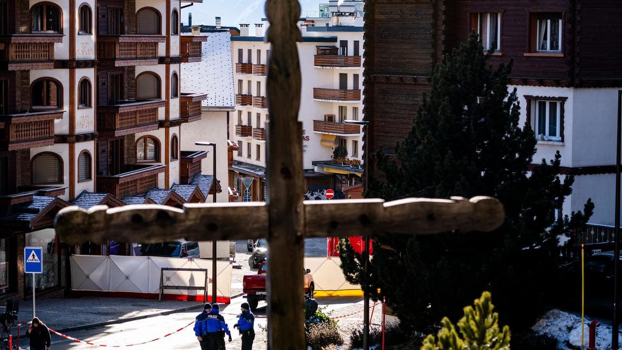 Police inspect area where a fire broke out at Le Constellation bar