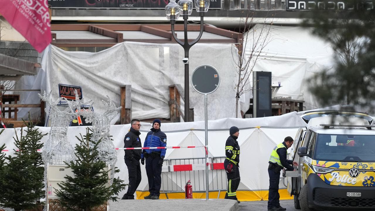 Security stands in front of the sealed off Le Constellation bar