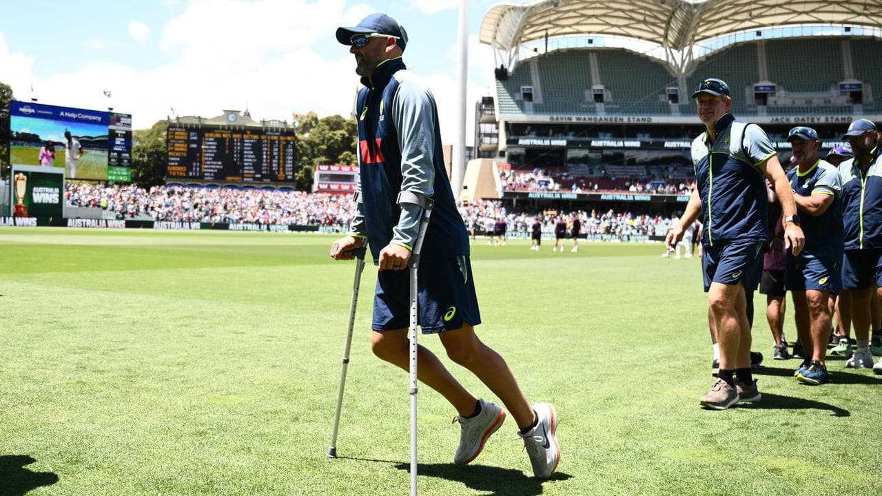 Nathan Lyon seen on crutches