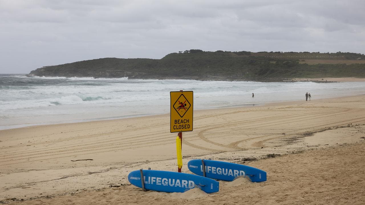 A beached closed sign