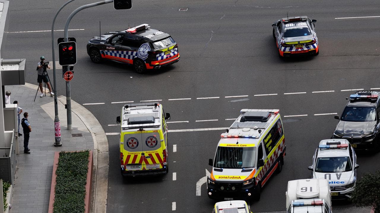 An ambulance takes the arrested man to hospital
